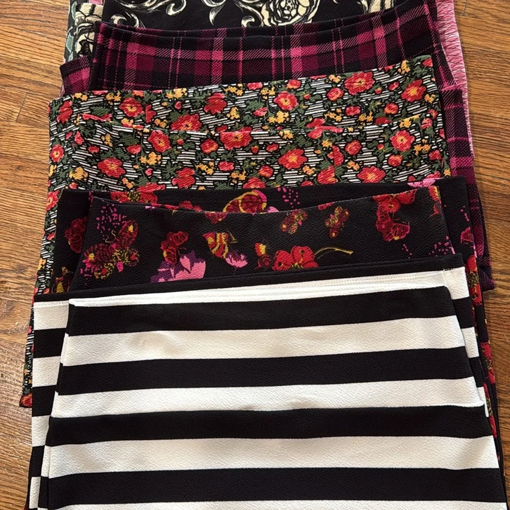 Group of 9 XS and Small LulaRoe skirts in various colors and patterns